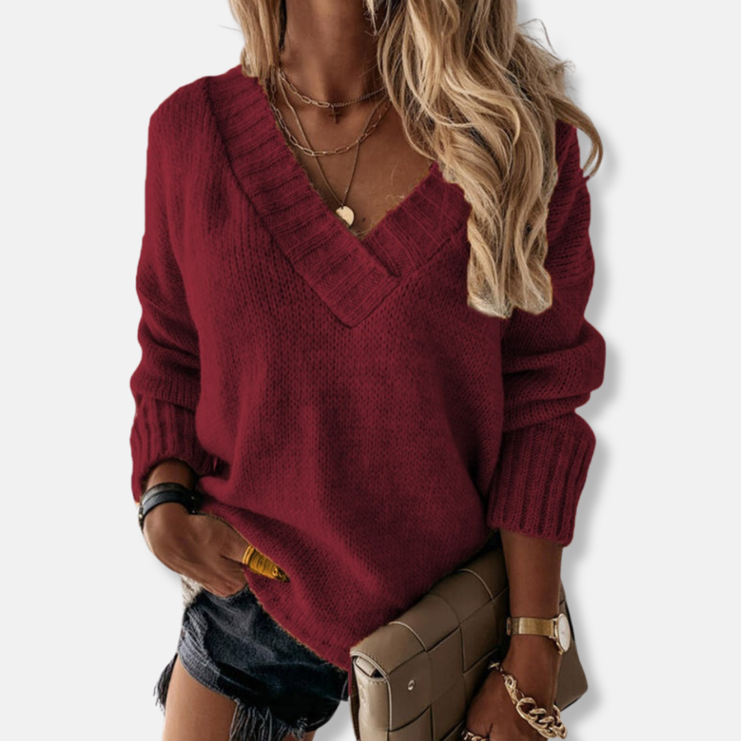 Women's deep V-neck relaxed fit knit sweatshirt with long sleeves and ribbed hem for cozy everyday style