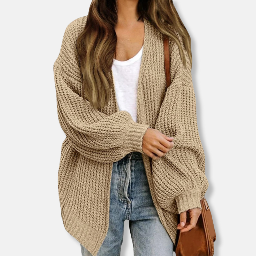 Women's oversized knit cardigan with voluminous lantern sleeves and ribbed cuffs for chic fall layering