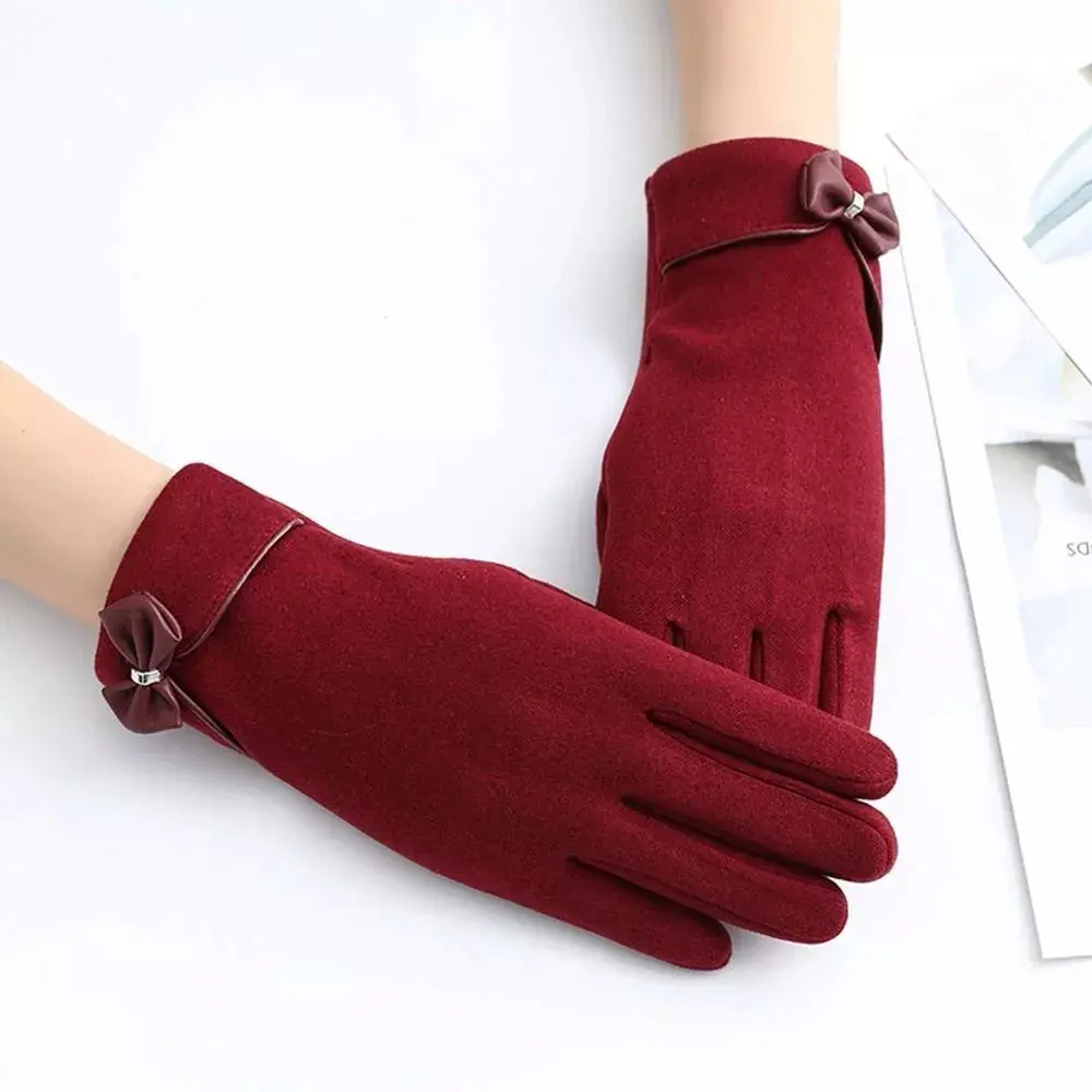 Women's black touchscreen winter gloves with elegant bow detail and split-finger design for cold weather