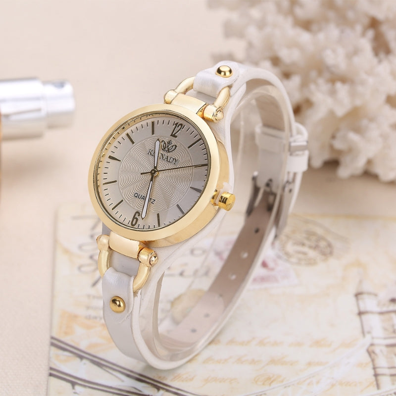 Maison d'Heure slim quartz watch engraved dial polished bezel brown leather strap refined professional style