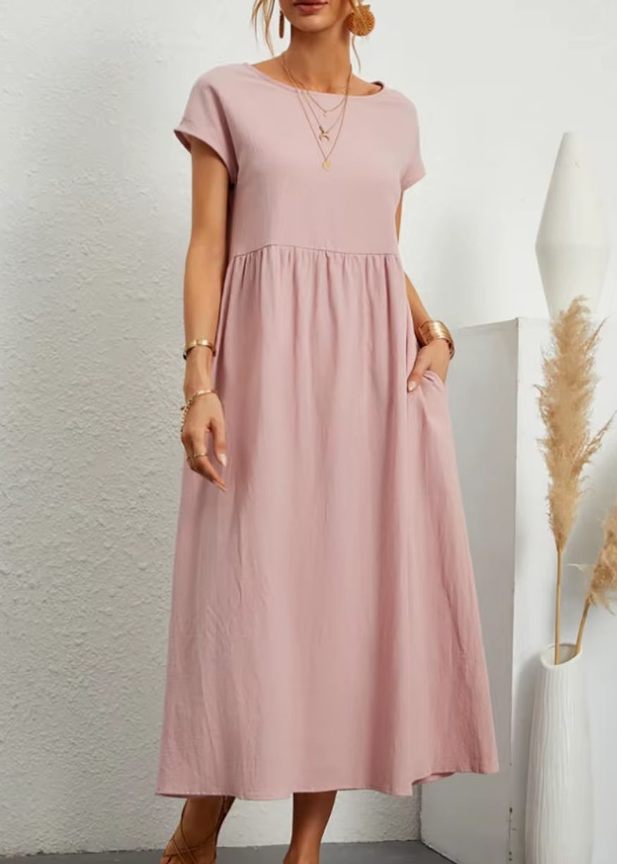 Women's relaxed midi dress with gathered waist, short sleeves, soft flowy fabric and pockets