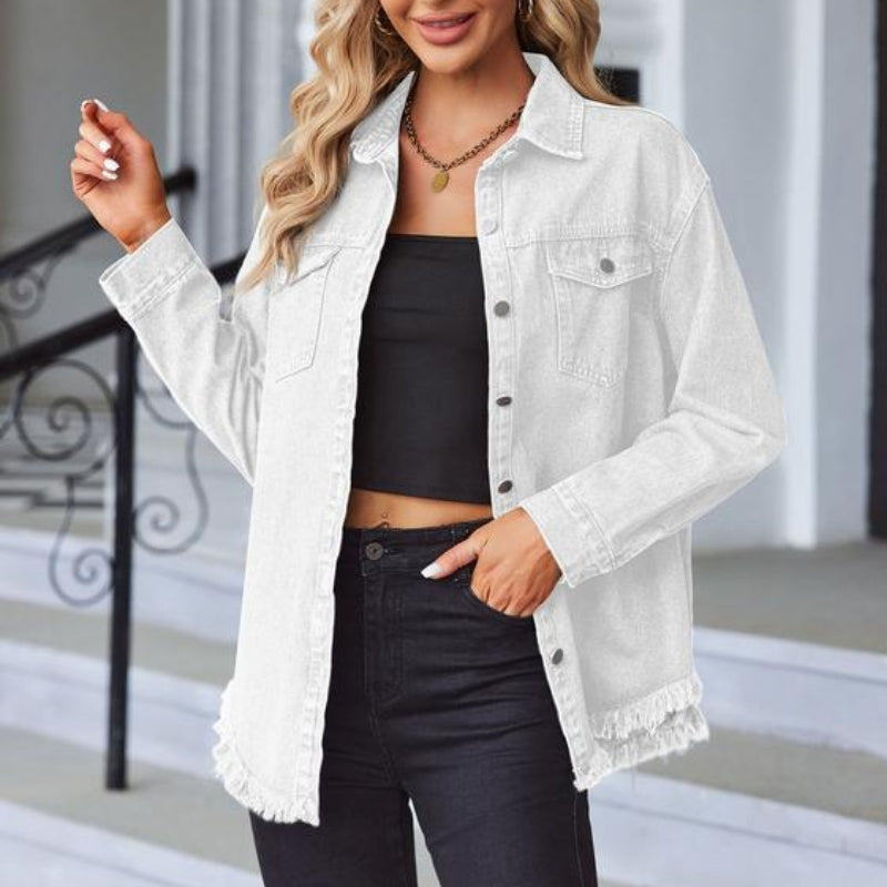 Women's oversized soft denim jacket with raw fringe detailing and snap front closure in classic blue
