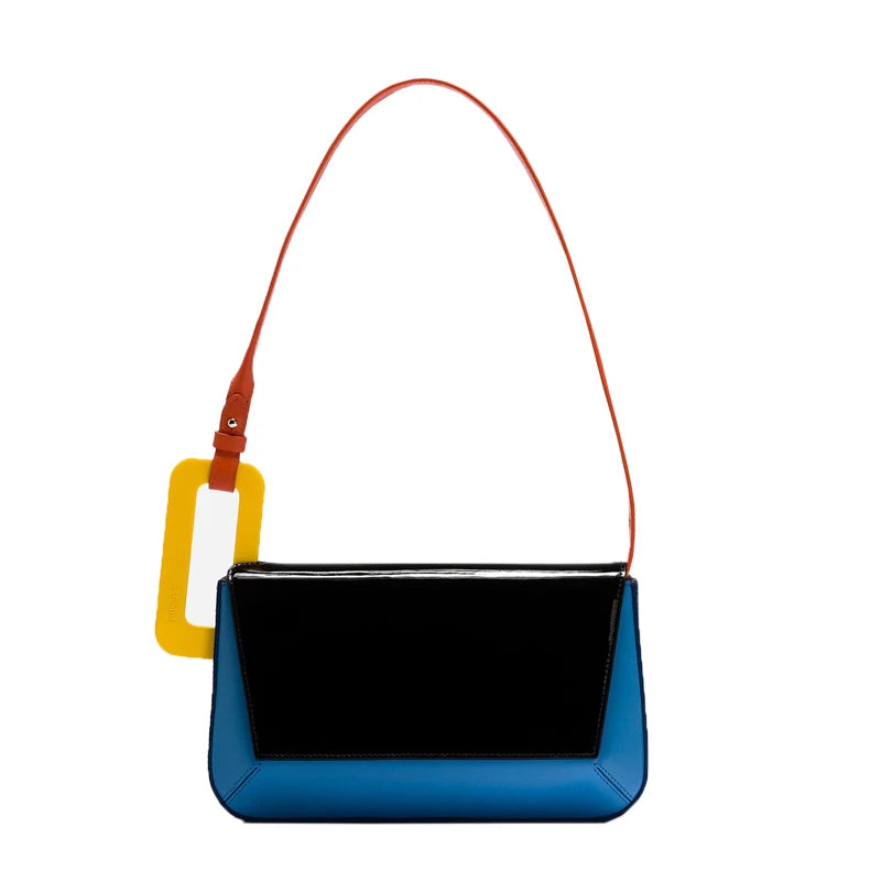 Multicolor glossy vegan leather structured shoulder bag with bold colorblock panels and sculptural resin buckle
