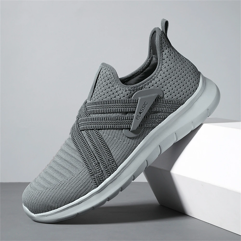 Gray slip-on walking sneakers with shock-absorbing sole, wide toe box, and padded heel collar