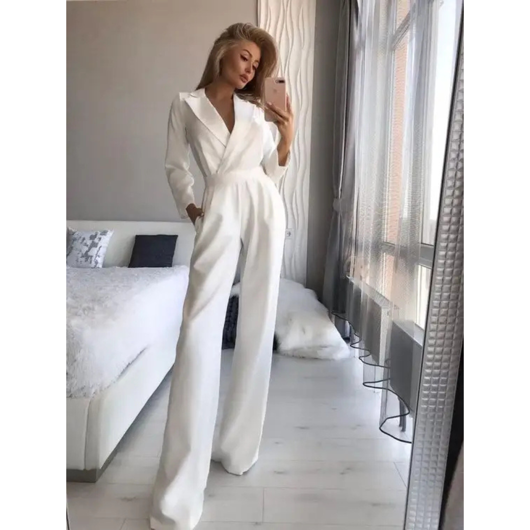 Black long-sleeve dressy women's jumpsuit with wide structured straps and fluid silhouette