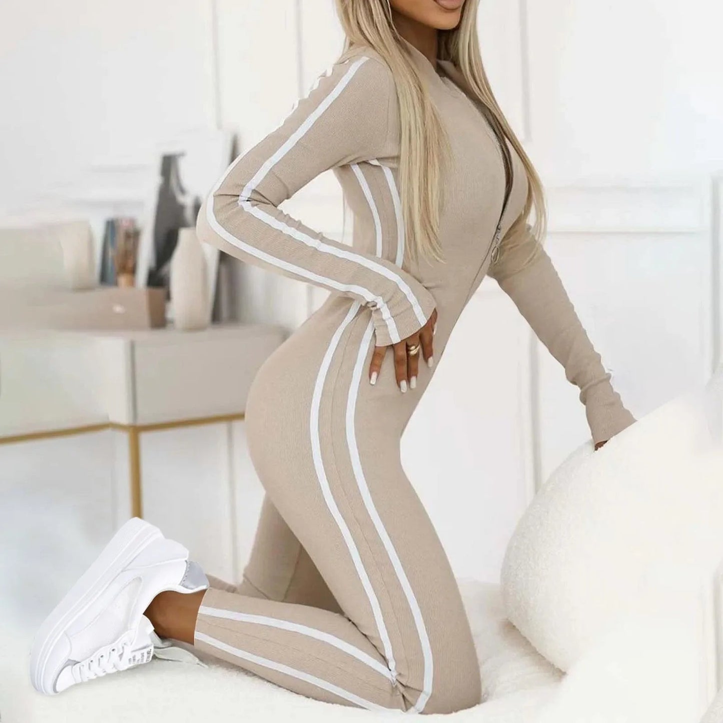 Women's black body-sculpting lounge jumpsuit with sleek silhouette and premium stretch fabric