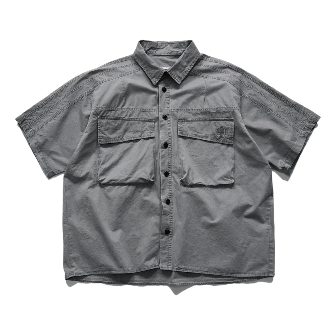 Beige loose-fit cotton cargo shirt with turn-down collar and dual chest pockets workwear style