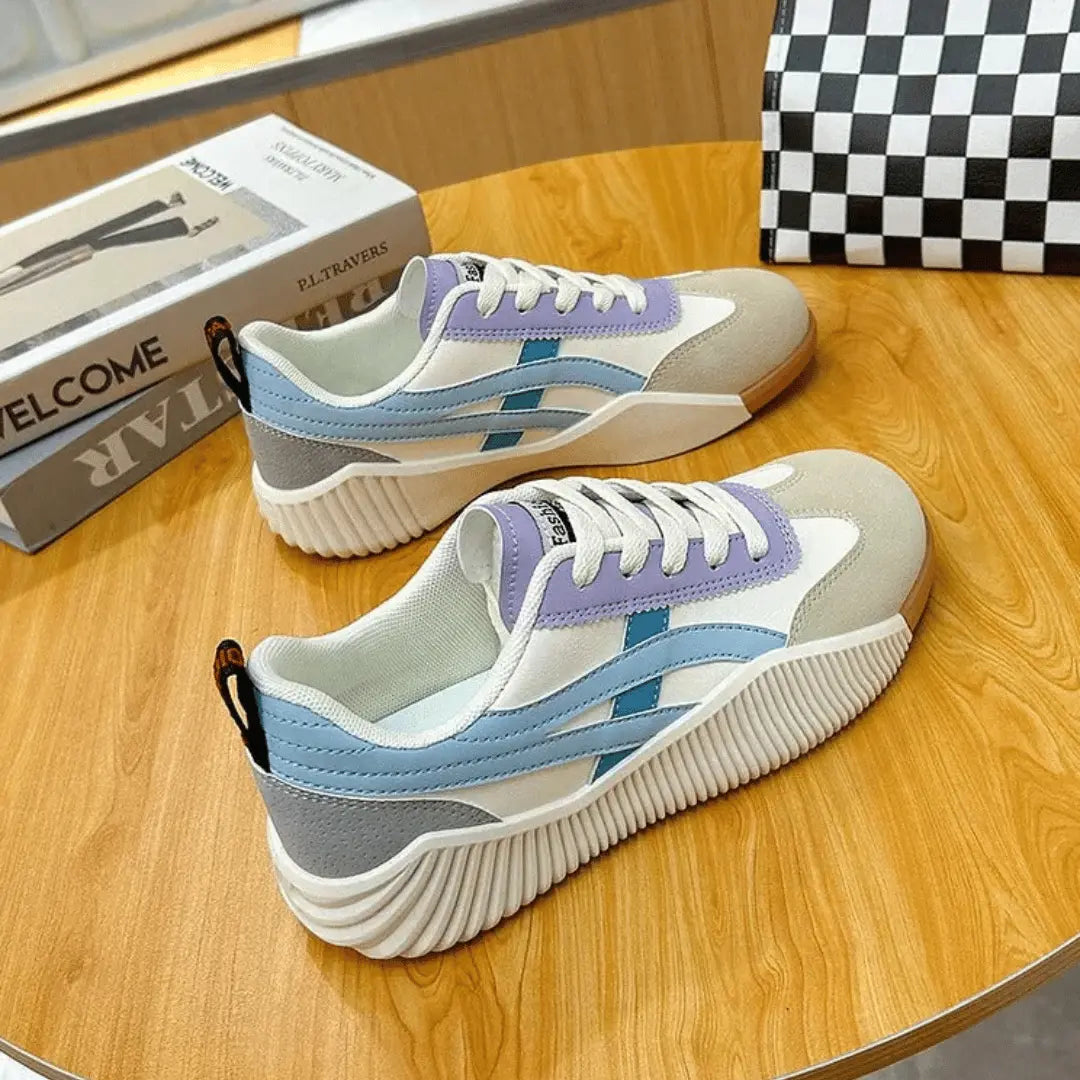 Women's chunky white canvas platform sneakers with leather accents and cloud-soft cushioned sole