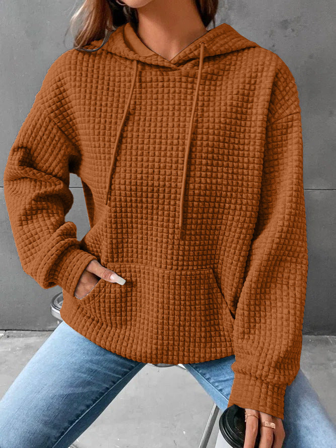 Women's loose fit hoodie with kangaroo pocket in soft textured fabric for casual everyday comfort