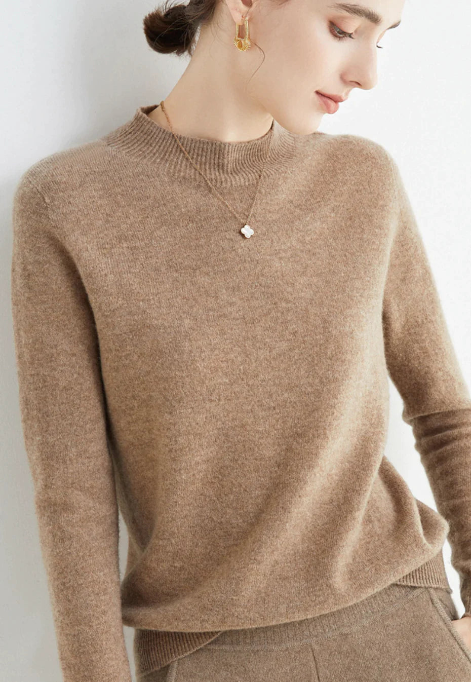 Women's elegant knit sweater neutral tone relaxed silhouette luxurious soft fabric all-occasion style