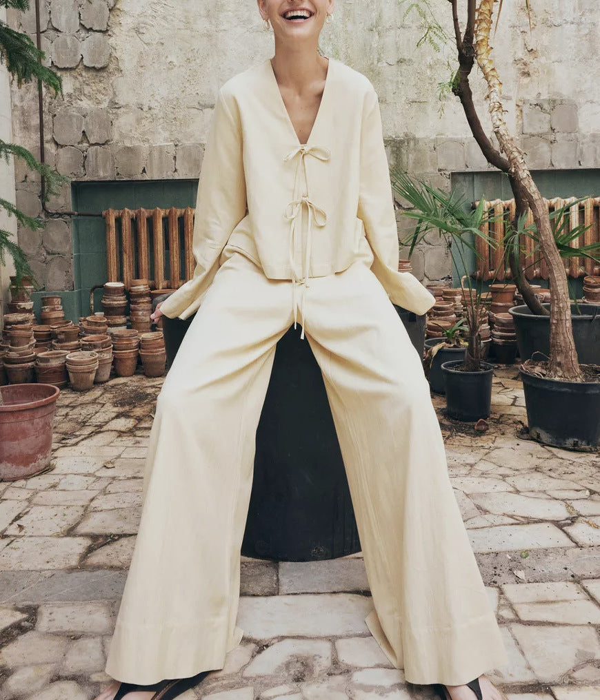 Women's wide-leg pants set with tie-top, minimalist two-piece office outfit in neutral tones