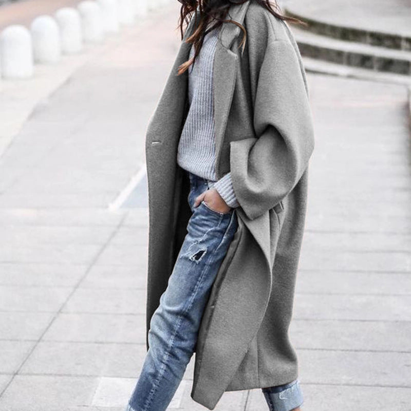 Women's elegant long polyester coat with lapel collar, single-breasted closure, and functional pockets
