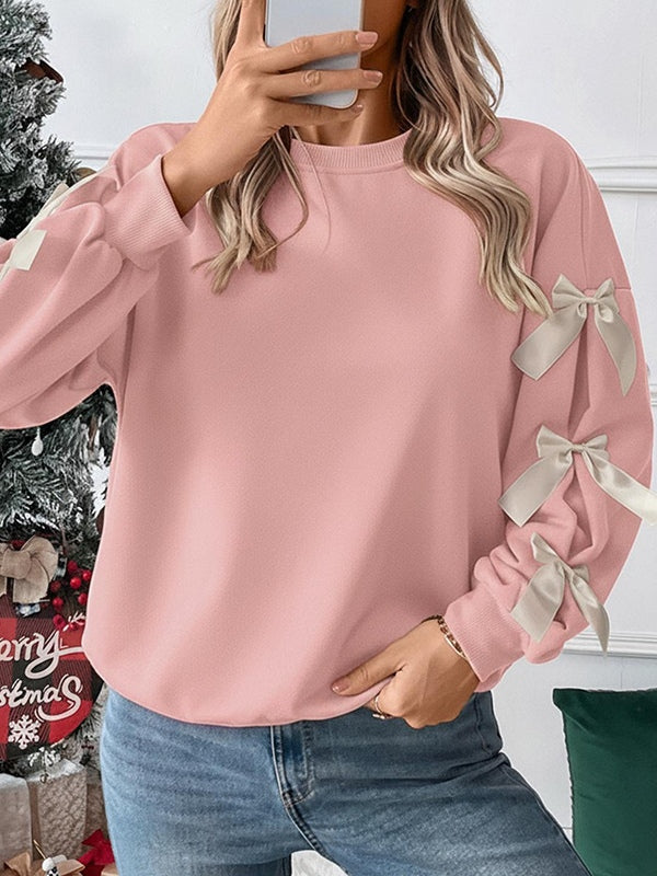 Women's loose hip-length sweatshirt with festive Christmas bow embroidery, round neck, cozy casual winter style