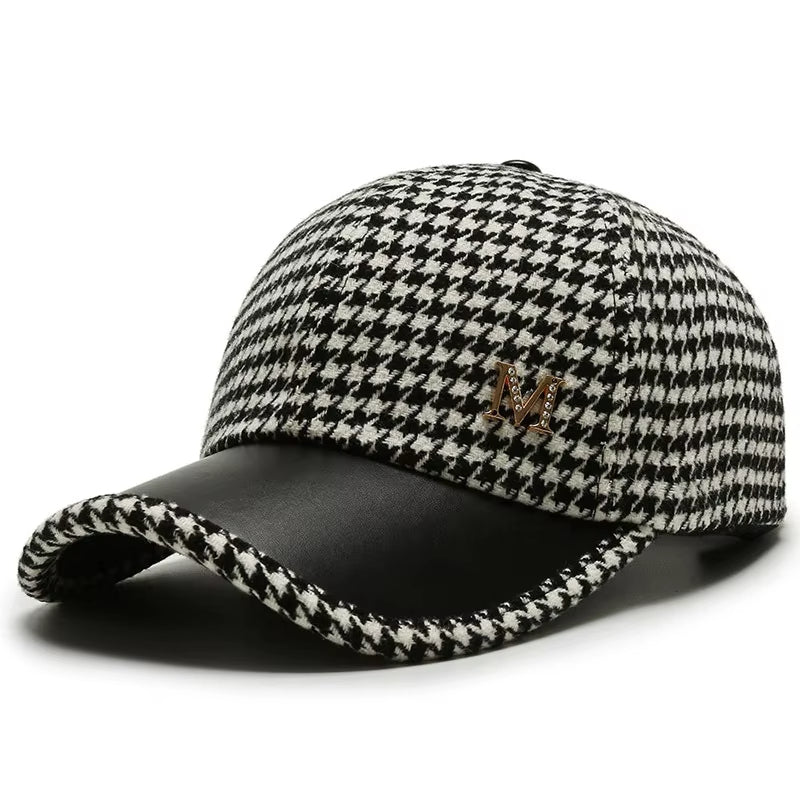 Black white houndstooth adjustable cap with premium leather accents and gold monogram detail