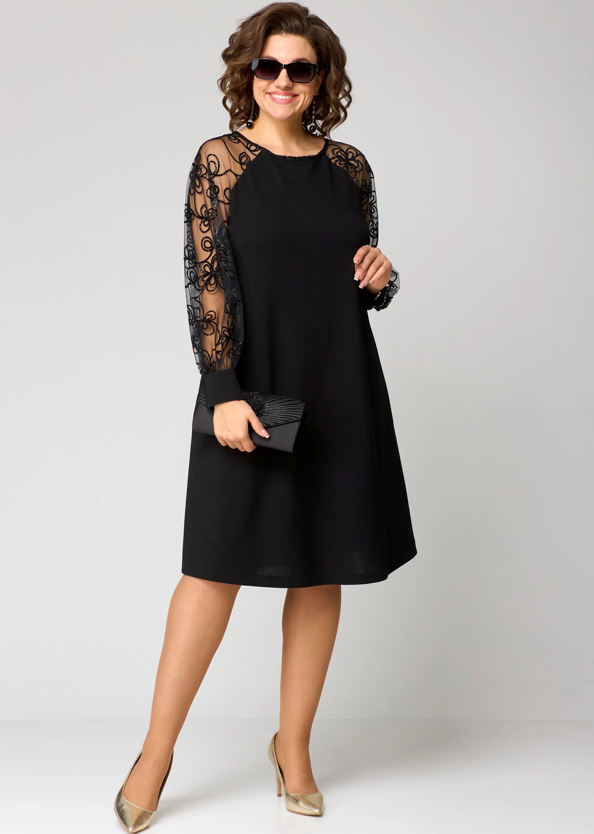 Ivory evening gown with sheer lace sleeves, relaxed A-line silhouette for formal occasions