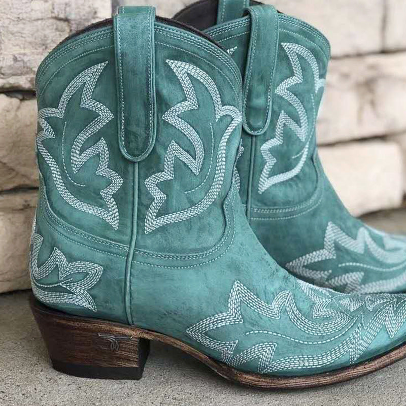 Women's vintage western ankle boots in brown with embroidered shaft, block heel, and studded buckle details