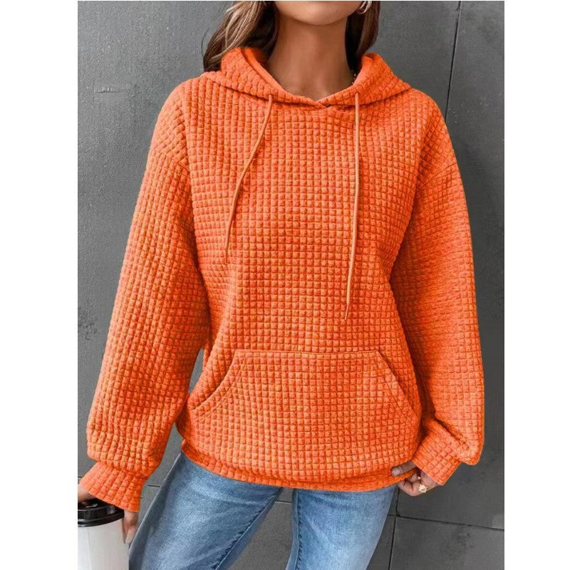 Women's loose fit hoodie with kangaroo pocket in soft textured fabric for casual everyday comfort