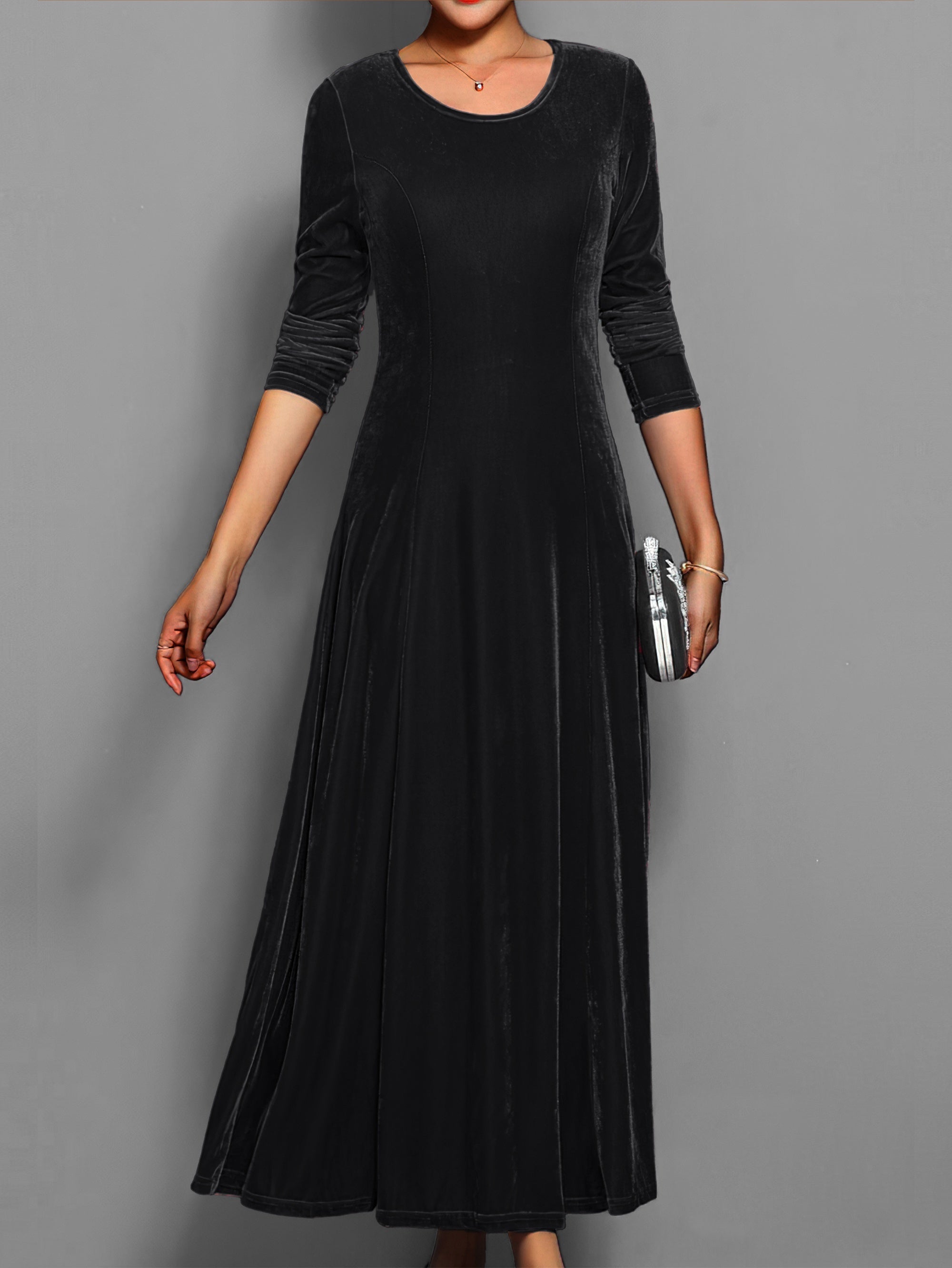 Women's black velvet formal long sleeve gown with subtle sheen, elegant party dress