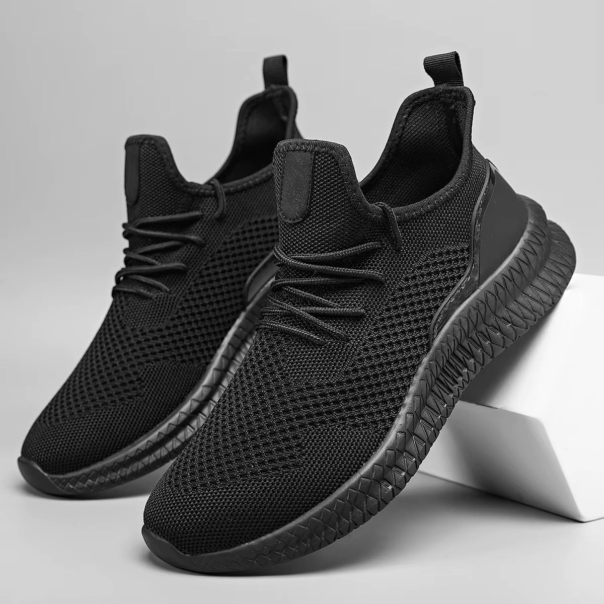 White lightweight athletic mesh sneaker with adaptive airflow upper and all-day grip sole