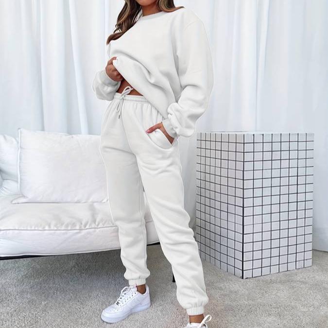 Women's matching grey sweatshirt and jogger lounge set with relaxed minimalist silhouette
