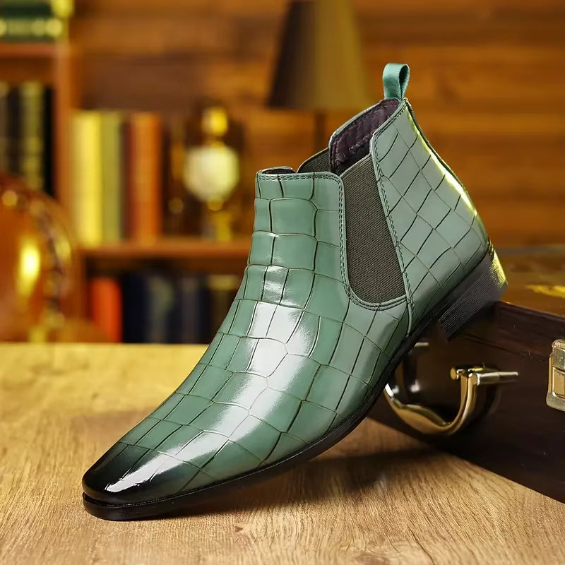Black crocodile-embossed vegan leather Chelsea boots with high-gloss finish and cushioned insole