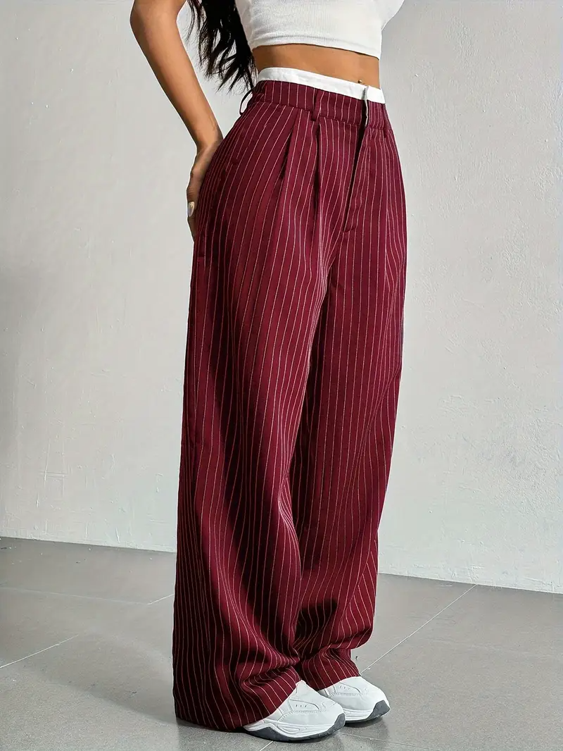 Navy pinstripe wide-leg trousers with elastic waistband, relaxed tailored fit for city professionals