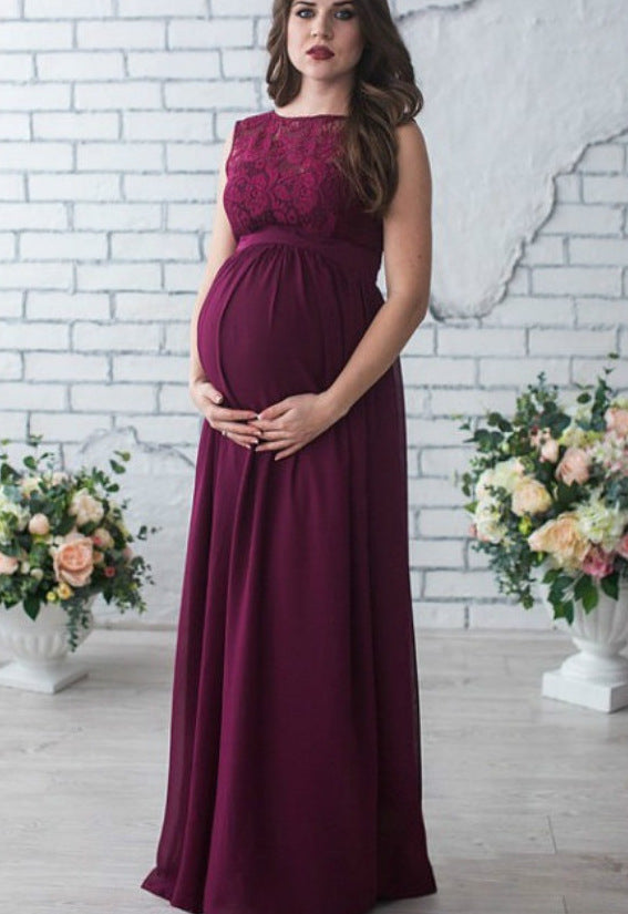 Ivory maternity maxi dress with lace bodice, empire waist, and flowing skirt for baby showers