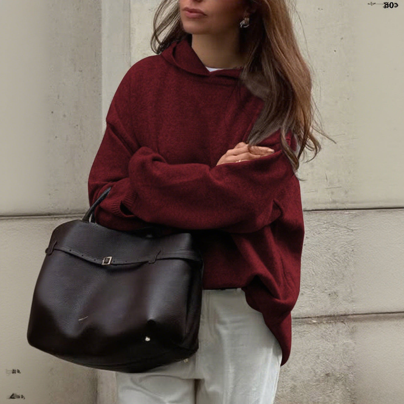 Women's oversized crew neck knit sweater in neutral tone, relaxed drapey silhouette soft fabric