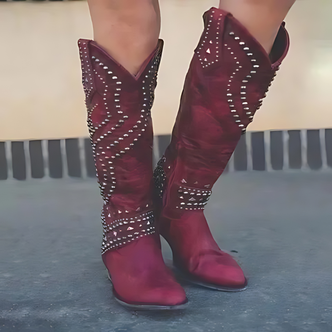 Women's western cowboy boots with bold studs, patterned stitching, and classic silhouette for everyday wear