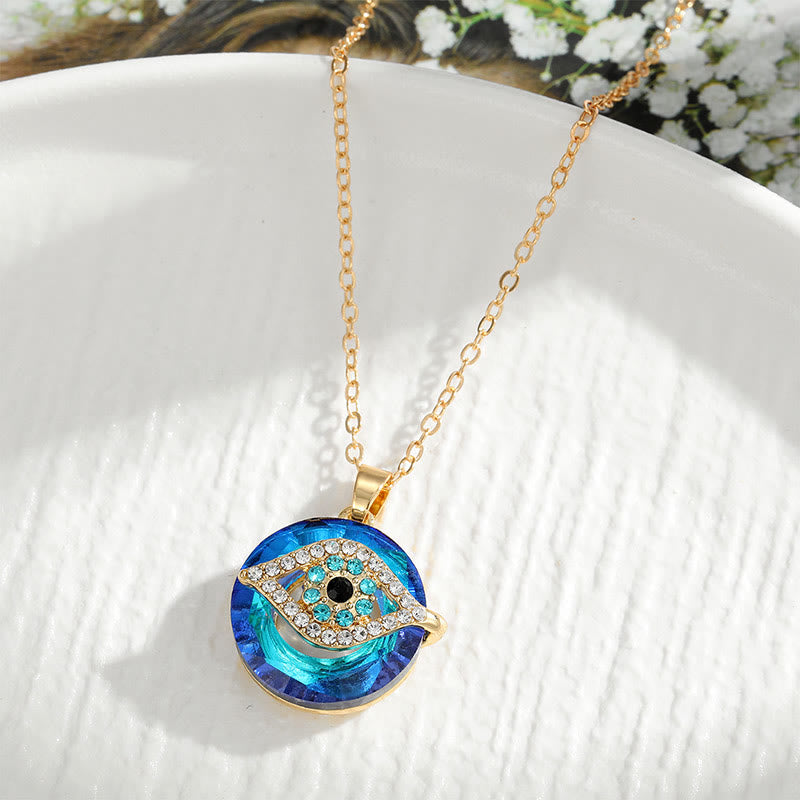 Silver evil eye protection necklace with blue accent stones, symbolic spiritual amulet for women