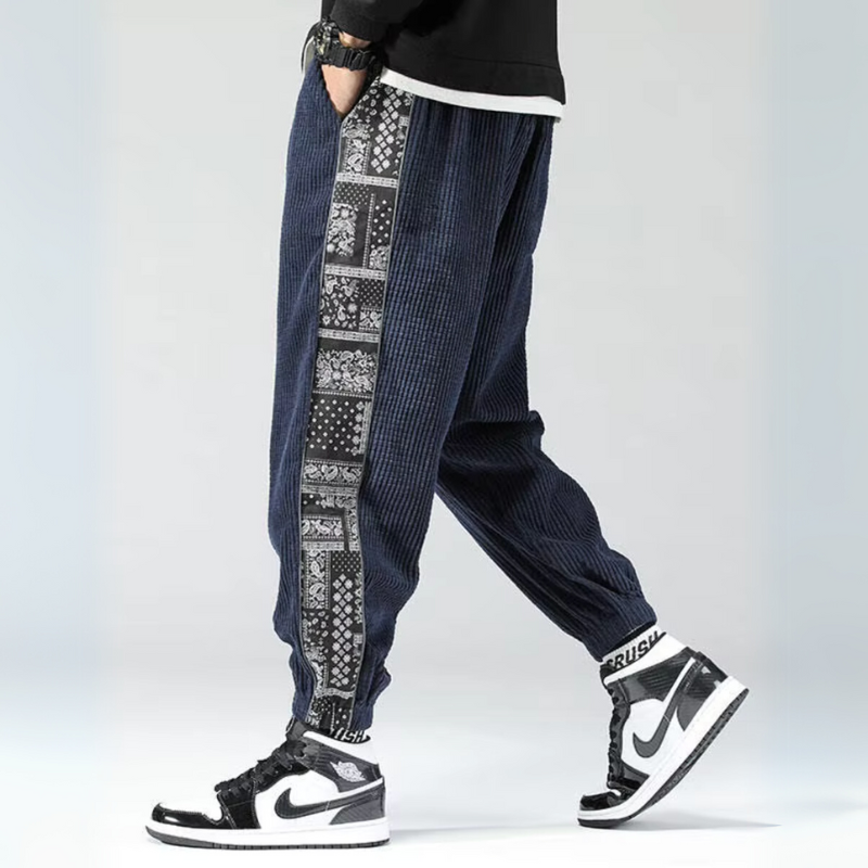 Beige corduroy jogger pants with bandana patchwork side panels, unisex relaxed fit streetwear