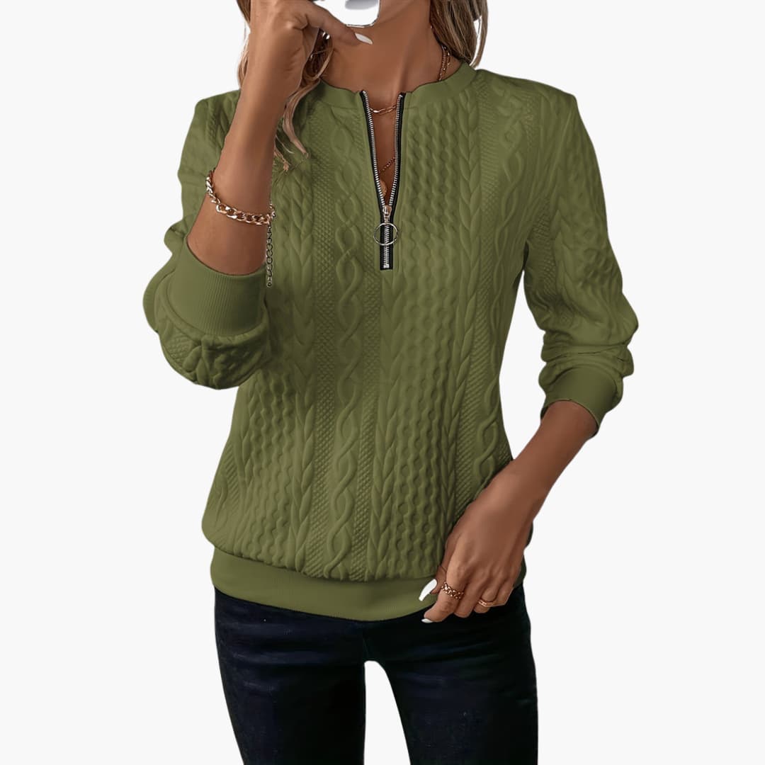 Women's cable knit pullover sweater with front zip neckline, long sleeves, and ribbed cuffs classic fit