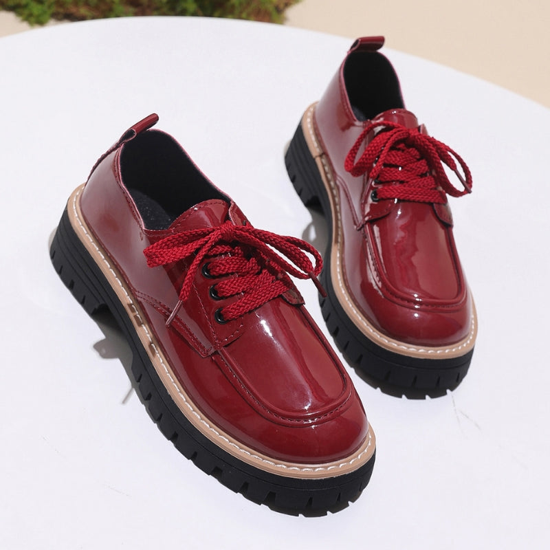 White leather platform loafers with rugged deep lug sole, bold elevated base for urban street style