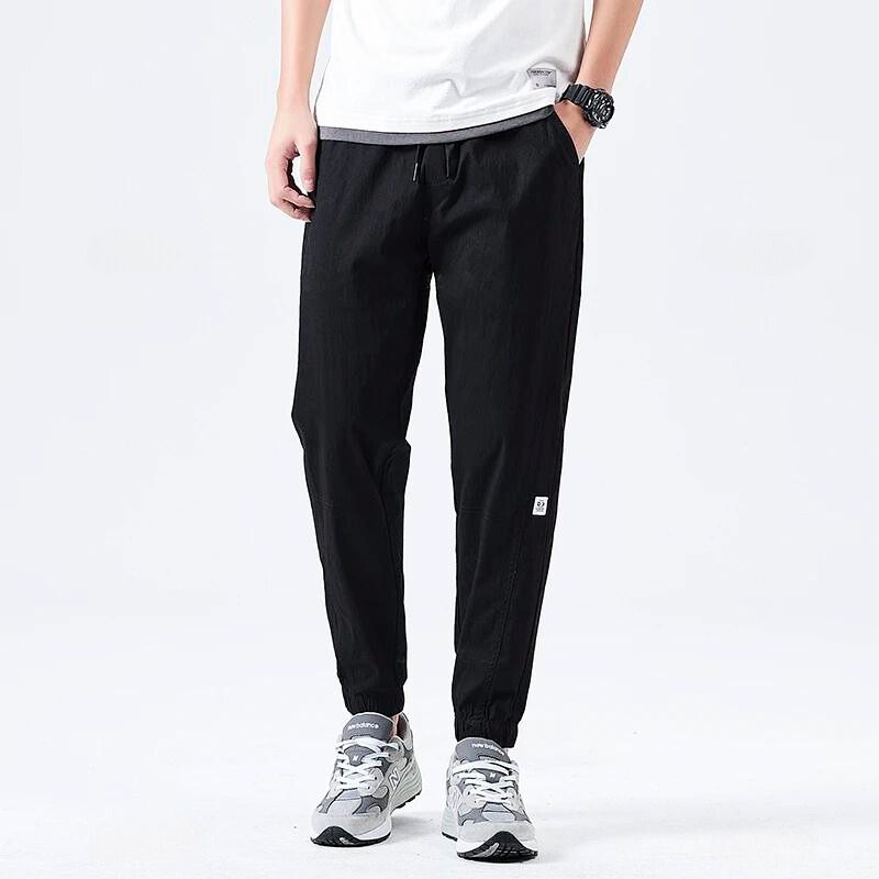 Bronte relaxed-fit stretch pants in neutral cotton-blend with flexible elastic waistband for all-day comfort