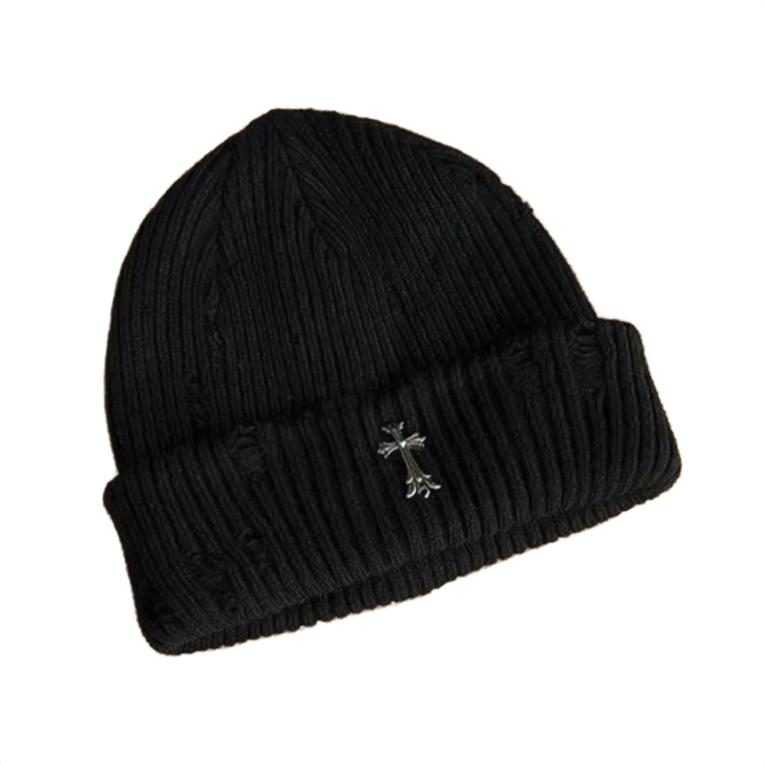 Black ribbed knit beanie with distressed finish and bold metal iron cross emblem for streetwear
