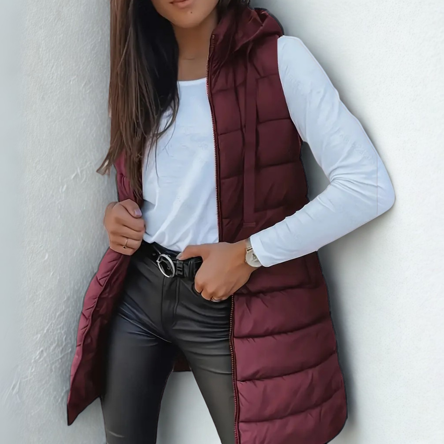 Women's long hooded puffer vest sleeveless quilted longline silhouette lightweight warmth