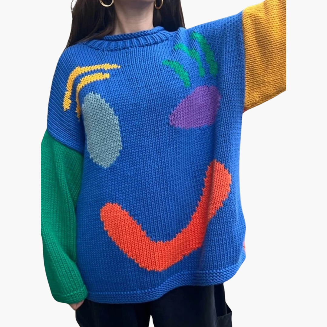 Women's oversized cream knitted sweater with playful smiley motif, cozy relaxed fit casual knitwear
