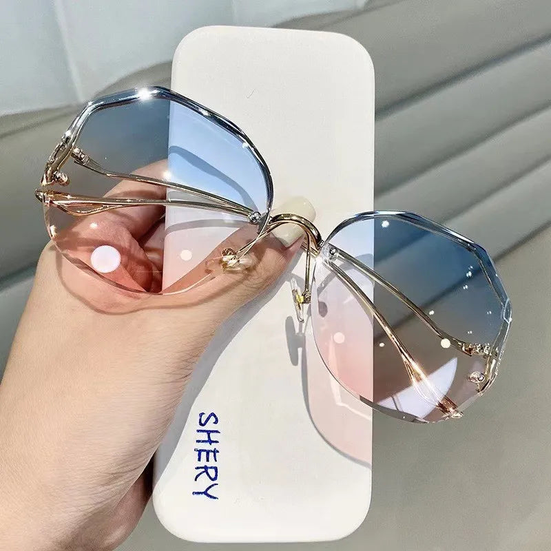 Women's rimless butterfly sunglasses bold petal-cut gradient UV400 lenses gold-tone temples