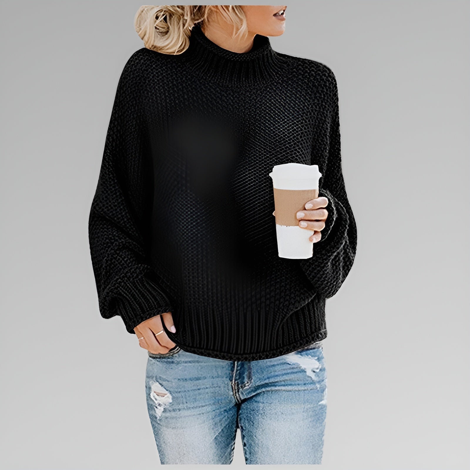 Women's oversized chunky knit sweater in neutral tones, relaxed fit with bold textured pattern for cozy warmth