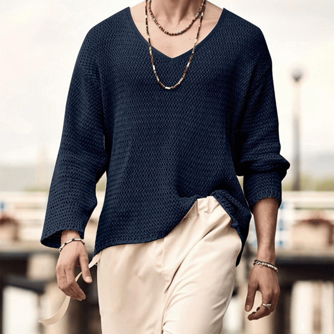 Men's relaxed knit sweater with deep V-neckline, breathable drape, versatile everyday style