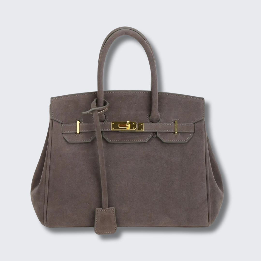 Kelly suede shoulder bag with gold hardware, structured silhouette, vintage-inspired luxury design