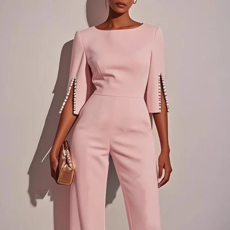 Ivory wide-leg jumpsuit with pearl embellishments, boat neckline, split sleeves, elegant eveningwear