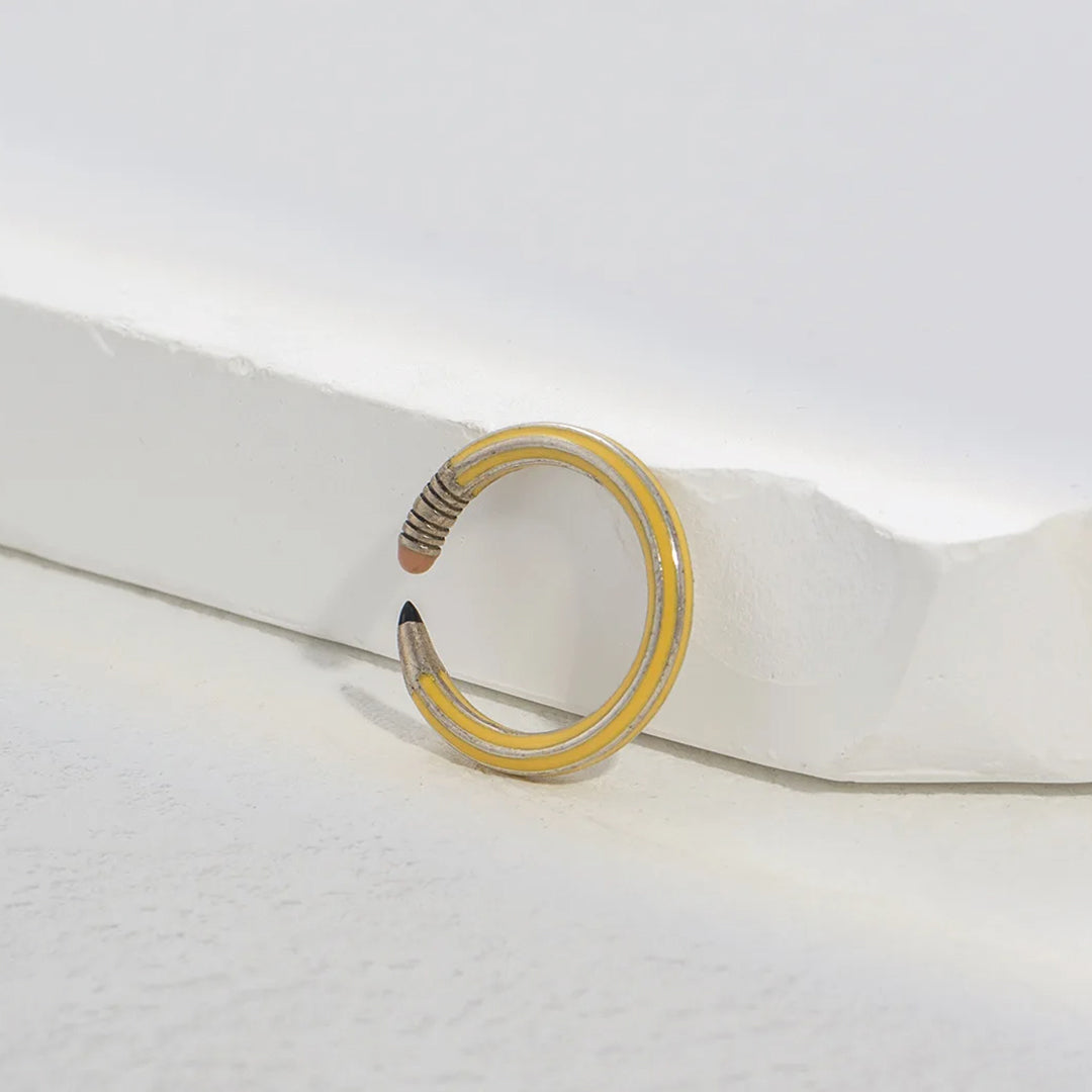Rose gold adjustable copper pencil-shaped statement ring with playful stationery-inspired silhouette