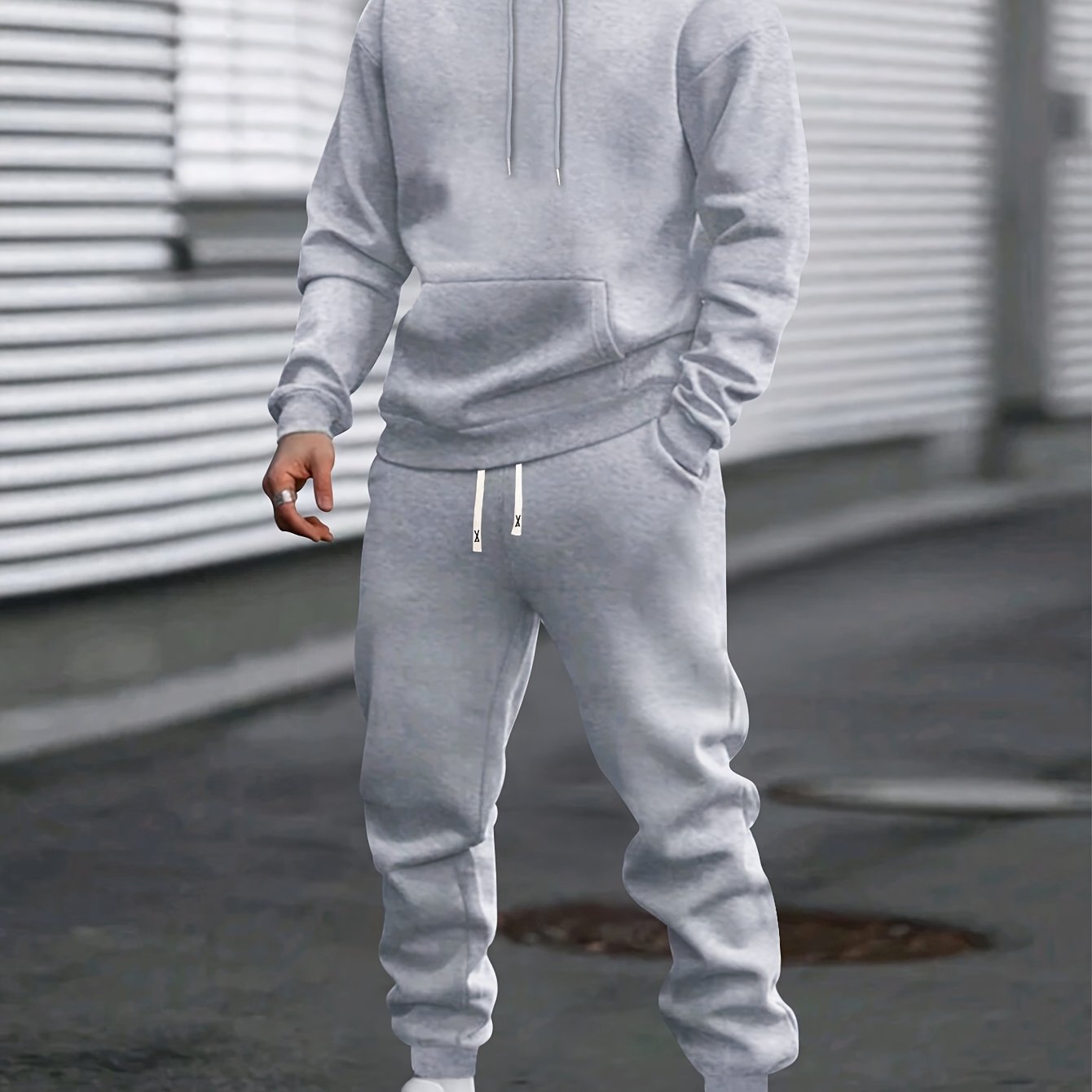 Men's gray pullover hoodie and jogger tracksuit set with drawstring hood for casual everyday wear