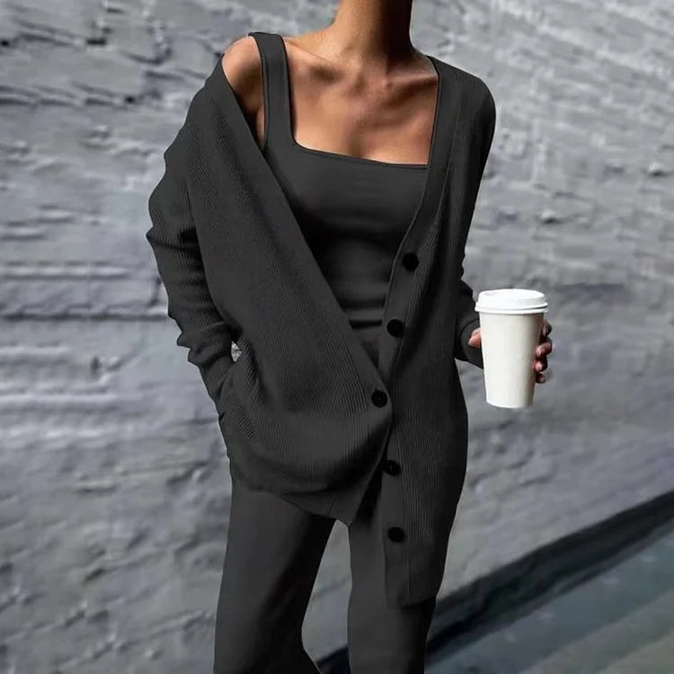 Women's oversized longline rib-knit cardigan with button closure and side pockets, relaxed all-season fit