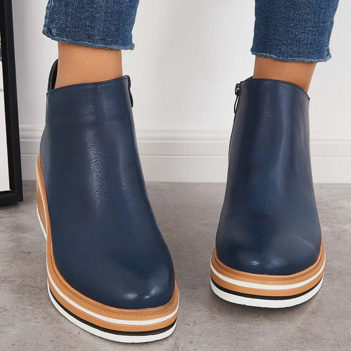 Women's black platform ankle boots with side zipper, elegant style for height and everyday stability