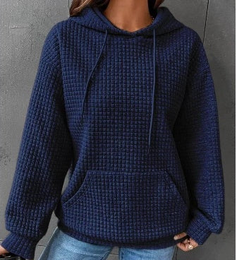 Women's loose fit hoodie with kangaroo pocket in soft textured fabric for casual everyday comfort