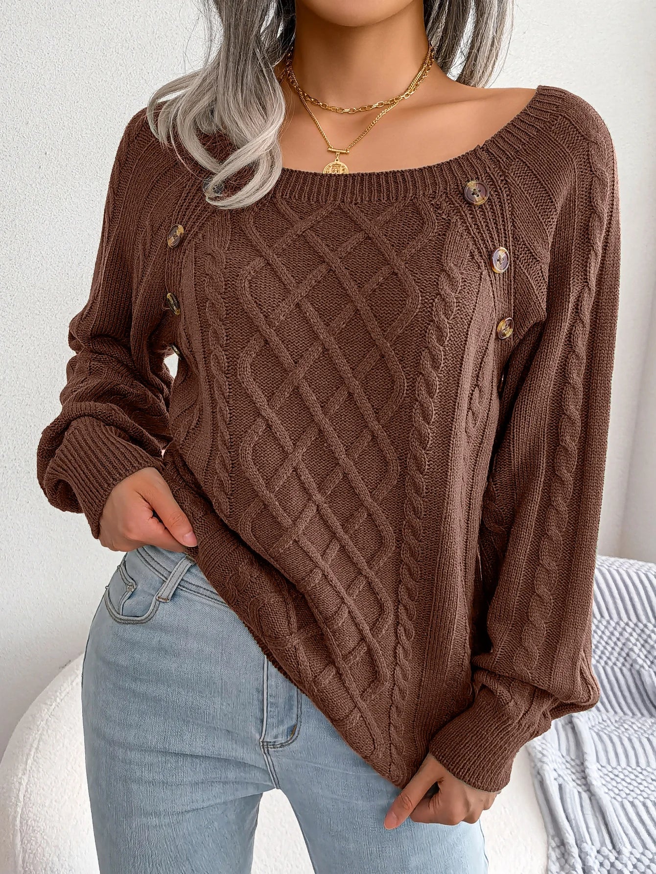Women's diamond cable knit pullover sweater with button details, cozy breathable layering style