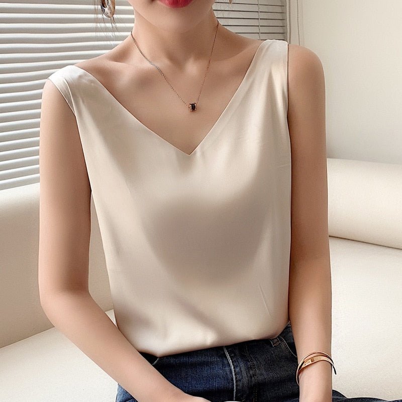 Women's ivory satin draped tank top with smooth lightweight fabric and elegant sheen for effortless layering