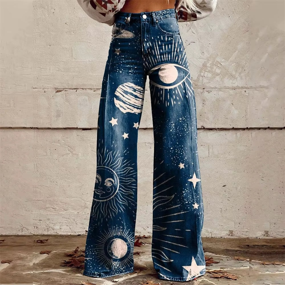 Bold high-waist flared denim jeans with celestial floral patterns in blue stretch cotton blend